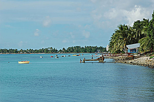 Tuvalu, Funafuti, view of a boat anchored on blue rippled water of the sea