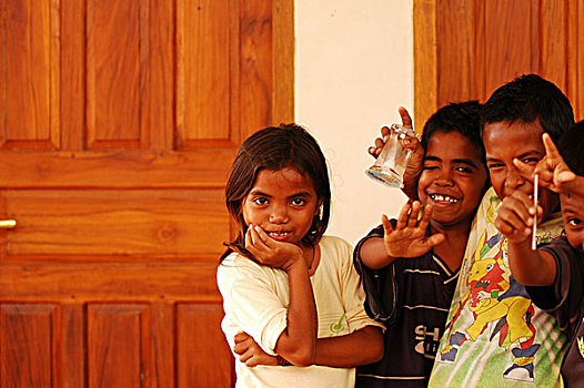 group,of,timorese,children,boys,and,girls,running,jumping,with,happiness