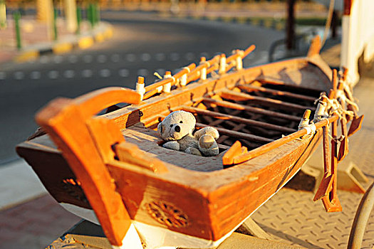 kuwait,city,boris,teddy,bear,taking,the,sun,in,wooden,ship