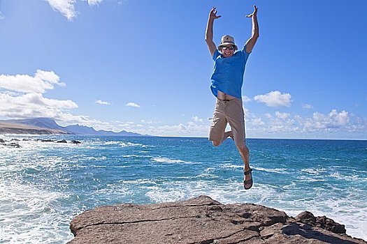 男人,跳跃,空中,海岸,富埃特文图拉岛,西班牙