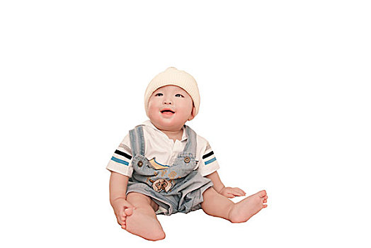一名7个月大的男婴坐着抬头渴望的看
