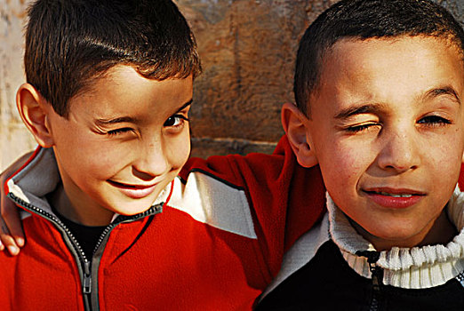 algeria,algiers,close-up,of,two,boys,embracing,and,smiling
