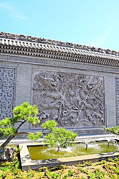 唐语砖雕双龙戏珠照壁