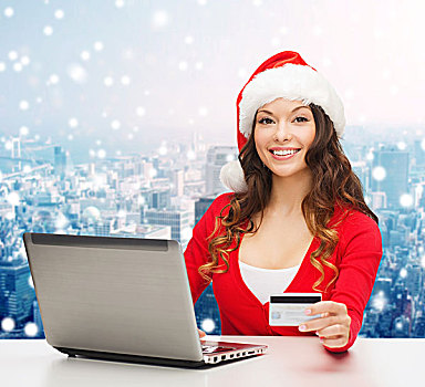 圣诞节,休假,科技,购物,概念,微笑,女人,圣诞老人,帽子,信用卡,笔记本电脑,上方,雪,城市,背景