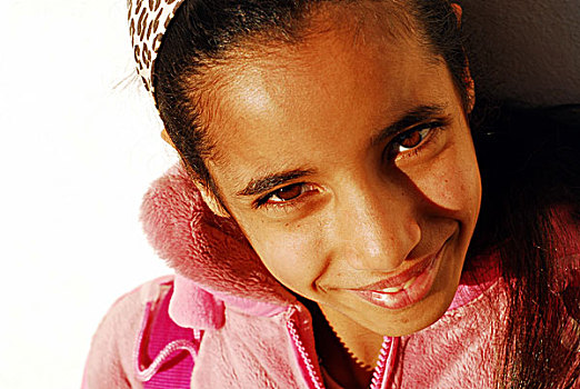 algeria,algiers,close-up,portrait,of,a,smiling,happy,girl,wearing,headscarf,and,rose,jacket