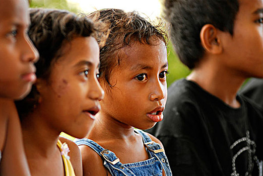 portrait,of,young,timorese,girl,with,dark,deep,brown,eyes