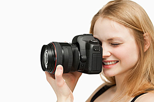 微笑,女人,拿着,相机,白色背景
