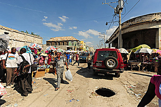 haiti,port,au,prince,big,sewage,hole,in,front,of,4x4,car