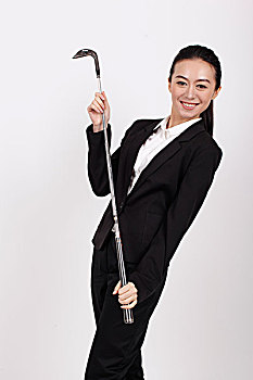 一个手握高尔夫球杆的商务女士