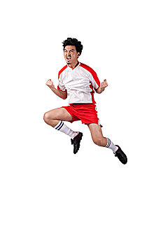一个穿足球队服跳跃呐喊的男青年