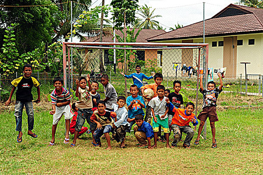 indonesia,sumatra,banda,aceh,group,of,happy,children,jumping