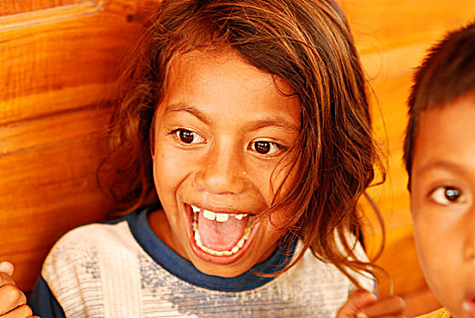 group,of,timorese,children,boys,and,girls,running,jumping,with,happiness