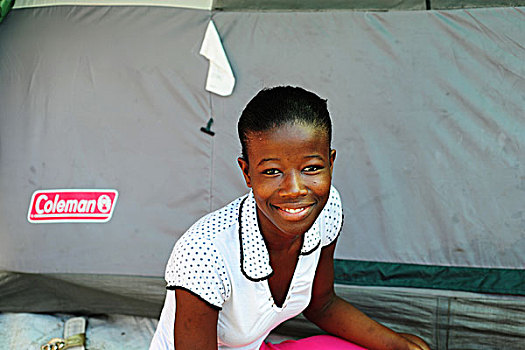 haiti,port,au,prince,portrait,of,teenage,girl,in,front,tent,refugee,camp