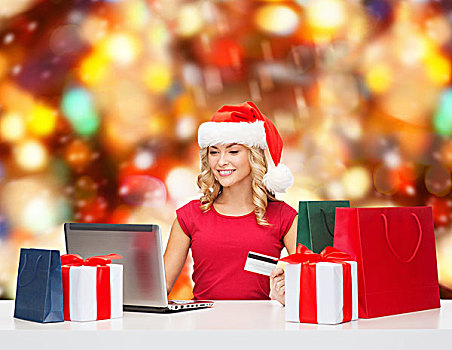圣诞节,休假,科技,购物,概念,微笑,女人,圣诞老人,帽子,礼物,信用卡,笔记本电脑,上方,红灯,背景