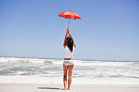 后视图,女人,拿着,伞,海滩