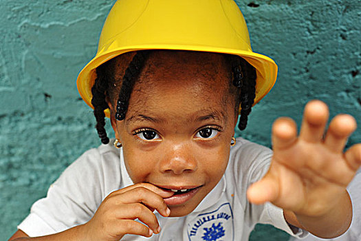 dominica,roseau,preschool,ccf,portrait,of,young,girl,with,a,construction,worker,hat