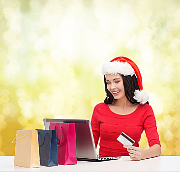圣诞节,圣诞,网上购物,概念,女人,圣诞老人,帽子,购物袋,笔记本电脑,信用卡