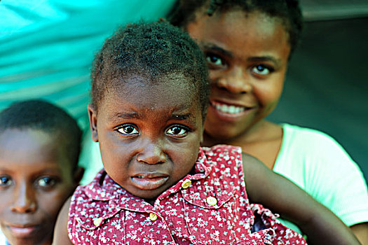 haiti,port,au,prince,portrait,of,scared,young,girl