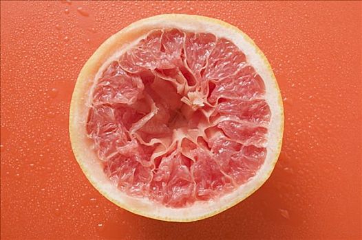 粉红葡萄柚,橙色背景