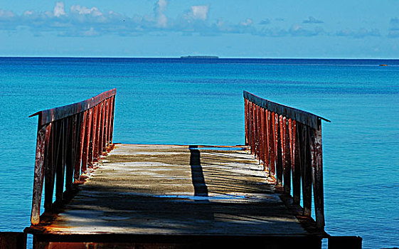 tuvalu,funafuti,view,of,a,boat,anchored,on,blue,rippled,water,the,sea