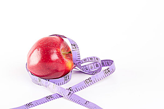 健康概念,一个苹果和软尺