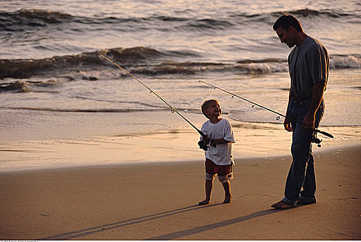 父子,鱼竿,海滩