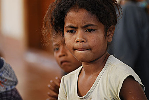 portrait,of,2,young,timorese,girls,looking,up,with,amazed,eyes