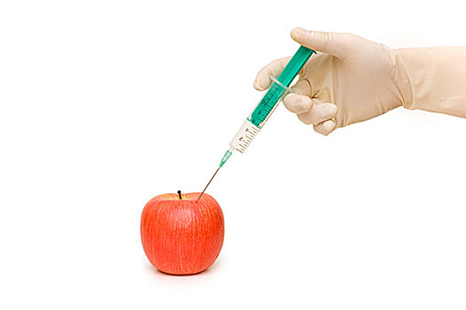手,注射器,红苹果,白色背景