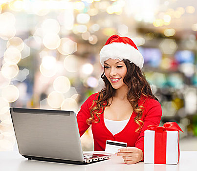 圣诞节,休假,科技,购物,概念,微笑,女人,圣诞老人,帽子,礼盒,信用卡,笔记本电脑,上方,背景