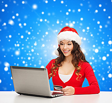 圣诞节,休假,科技,购物,概念,微笑,女人,圣诞老人,帽子,信用卡,笔记本电脑,上方,蓝色,雪,背景