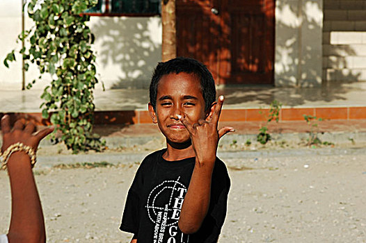 group,timorese,children,with,one,tongue,out
