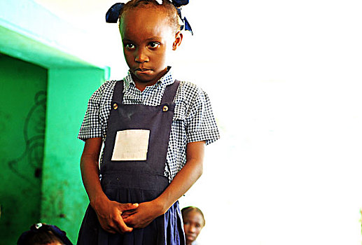 haiti,port,au,prince,portrait,of,schoolgirl,looking,sad