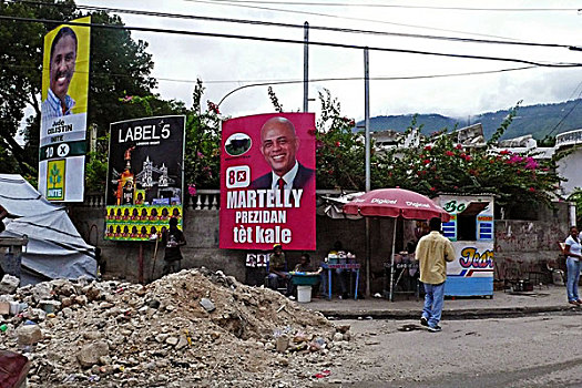 haiti,port,au,prince,presidential,candidate,martelly,advertisement,in,front,of,ruin