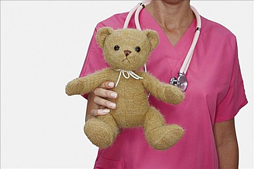 腰部,女护士,拿着,泰迪熊