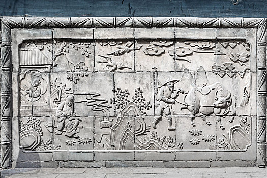 中国山西省平遥古城晋商马家大院内古建筑砖雕墙