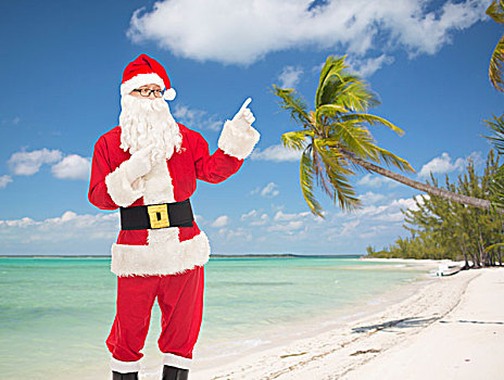 圣诞节,休假,手势,旅行,人,概念,男人,服饰,圣诞老人,指向,手指,上方,热带沙滩,背景