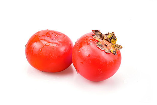 白色背景下的红柿子特写