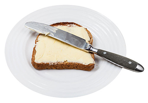 面包黄油,餐刀,白色背景,盘子