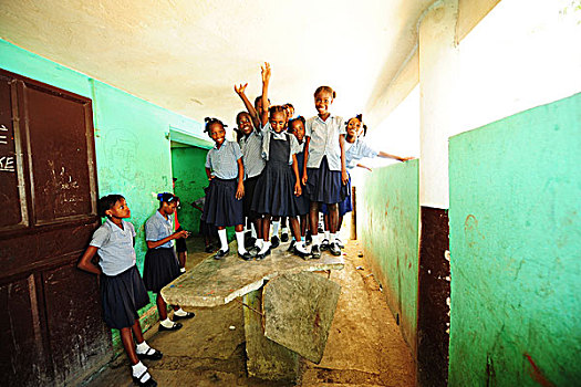 haiti,port,au,prince,schoolgirls,having,fun,on,destroyed,stone,table,in,camp,school,guatemala