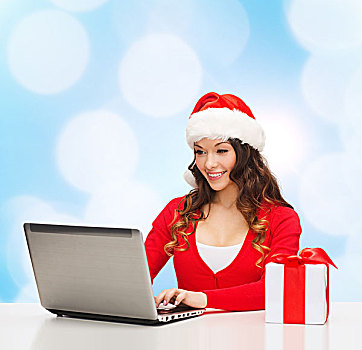 圣诞节,休假,科技,人,概念,微笑,女人,圣诞老人,帽子,礼盒,笔记本电脑,上方,蓝色,背景