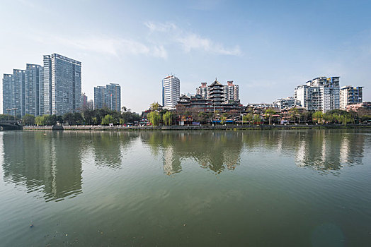 成都锦江河边的传统建筑亭子和现代高楼大厦