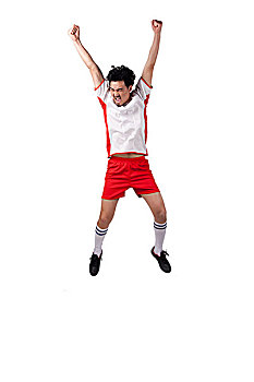 一个穿足球队服跳跃呐喊的男青年