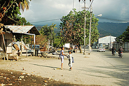 burned,out,iron,and,metal,left,in,the,streets,of,dili,under,grey,clouds