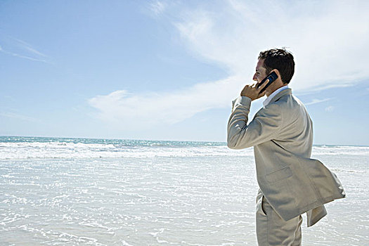 商务人士,手机,海滩,侧面视角
