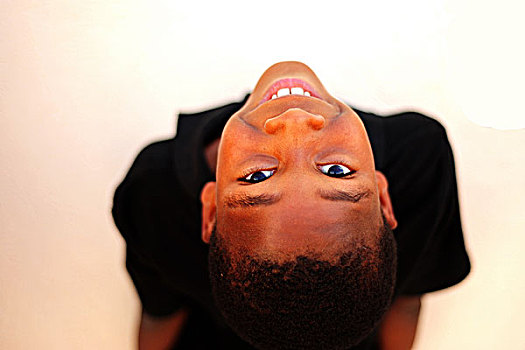 haiti,port,au,prince,portrait,of,boy,upside,down