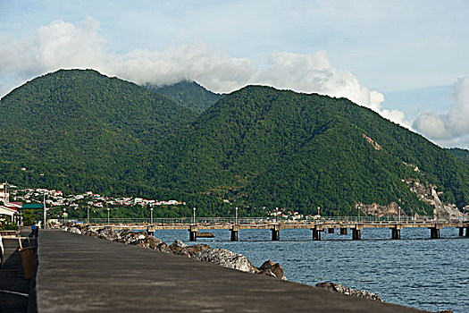 dominica,roseau,main,pier,with,green,hills,in,background